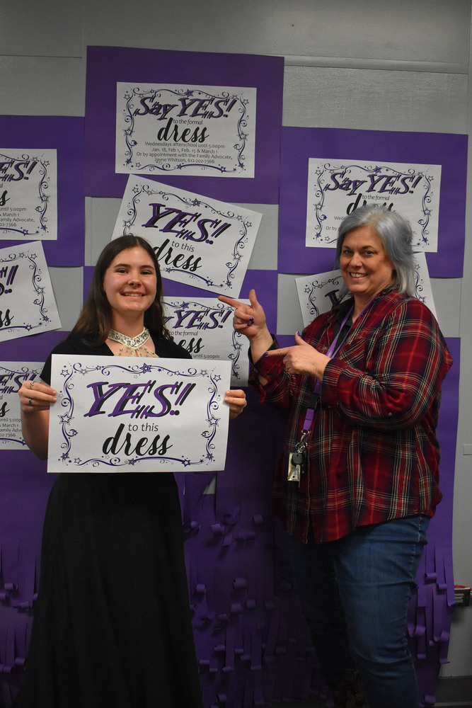 Faye Jones and Jane Whitson posing with a Say Yes to The Dress sign