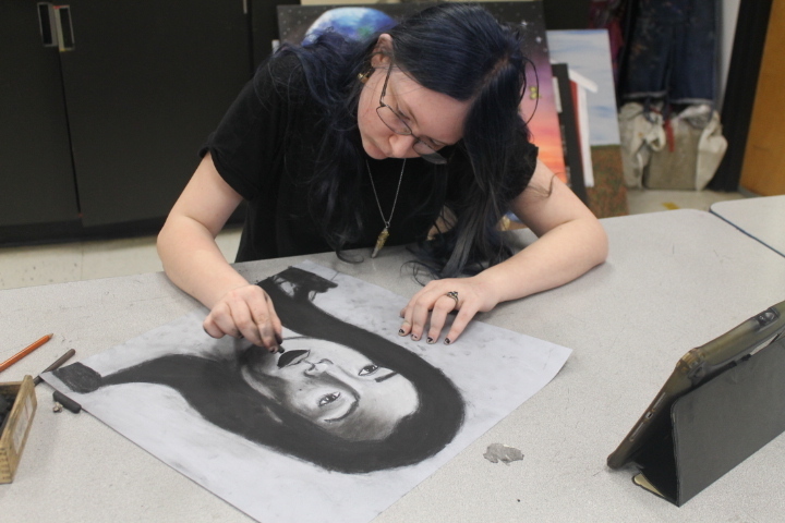Celina, Sophomore, working on her last art project. 